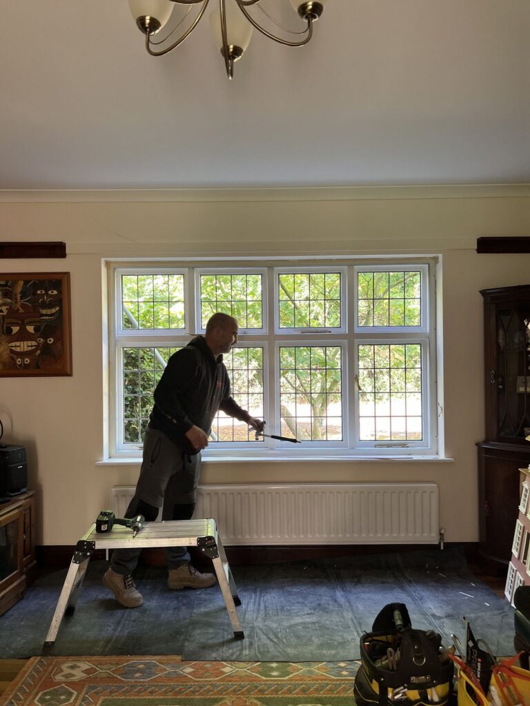 Wombourne Windows fitter removing an original leaded window